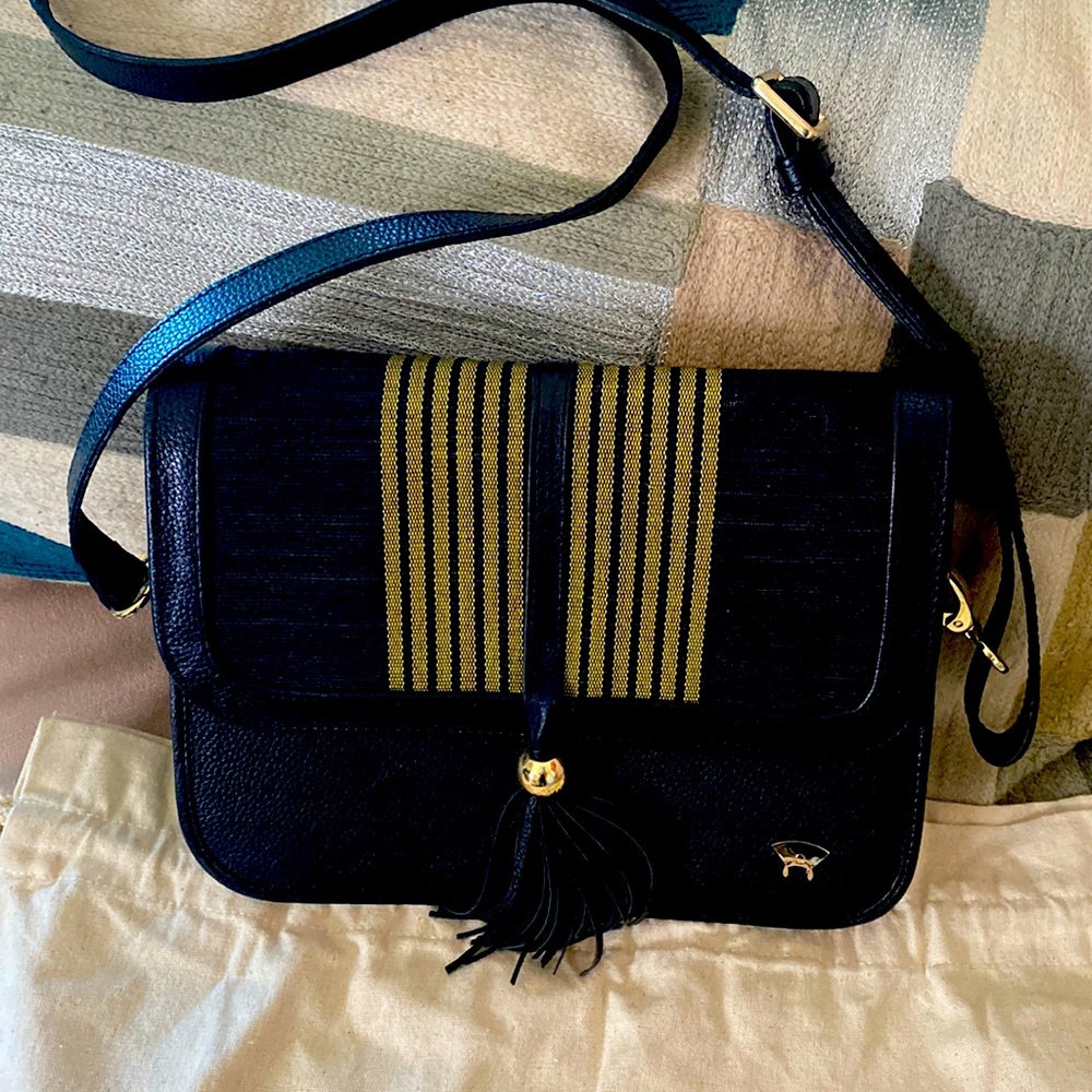 Olori leather and fabric purse in black. Color no longer available! Like new.